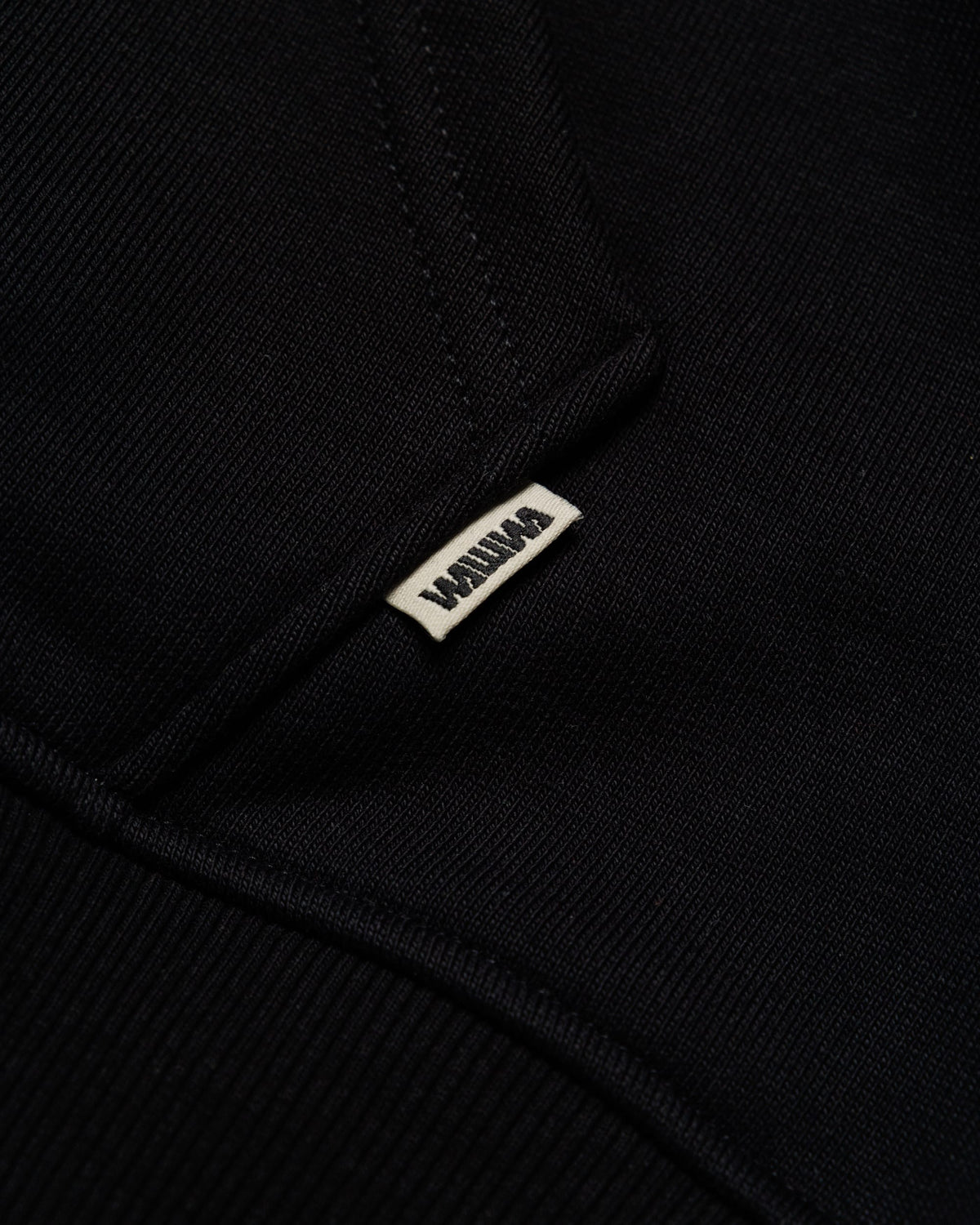 Heavyweight Two-Way Zip Hoody - Black — Hem label branding detail
