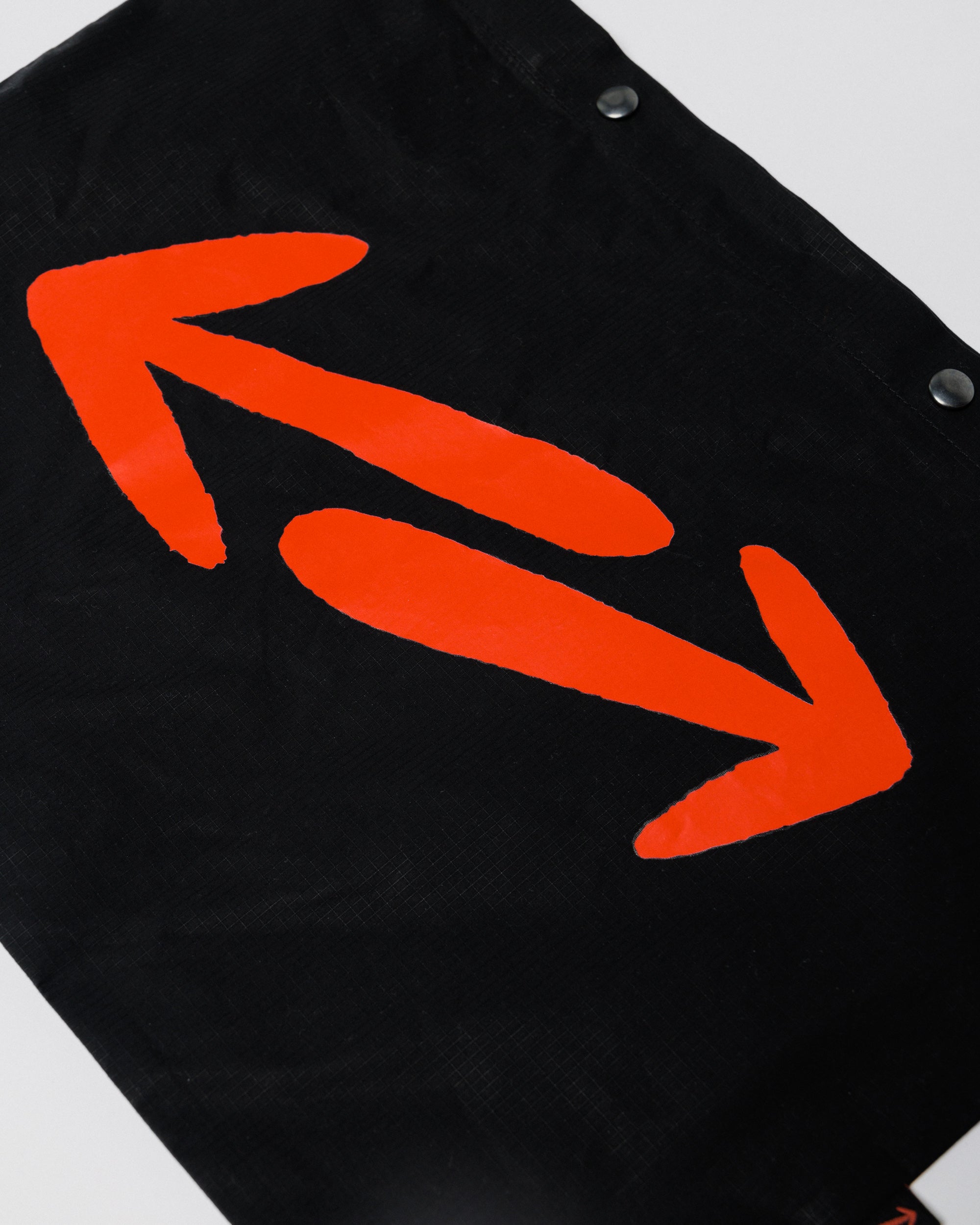 Outnback Musette in black, woven logo tag detail