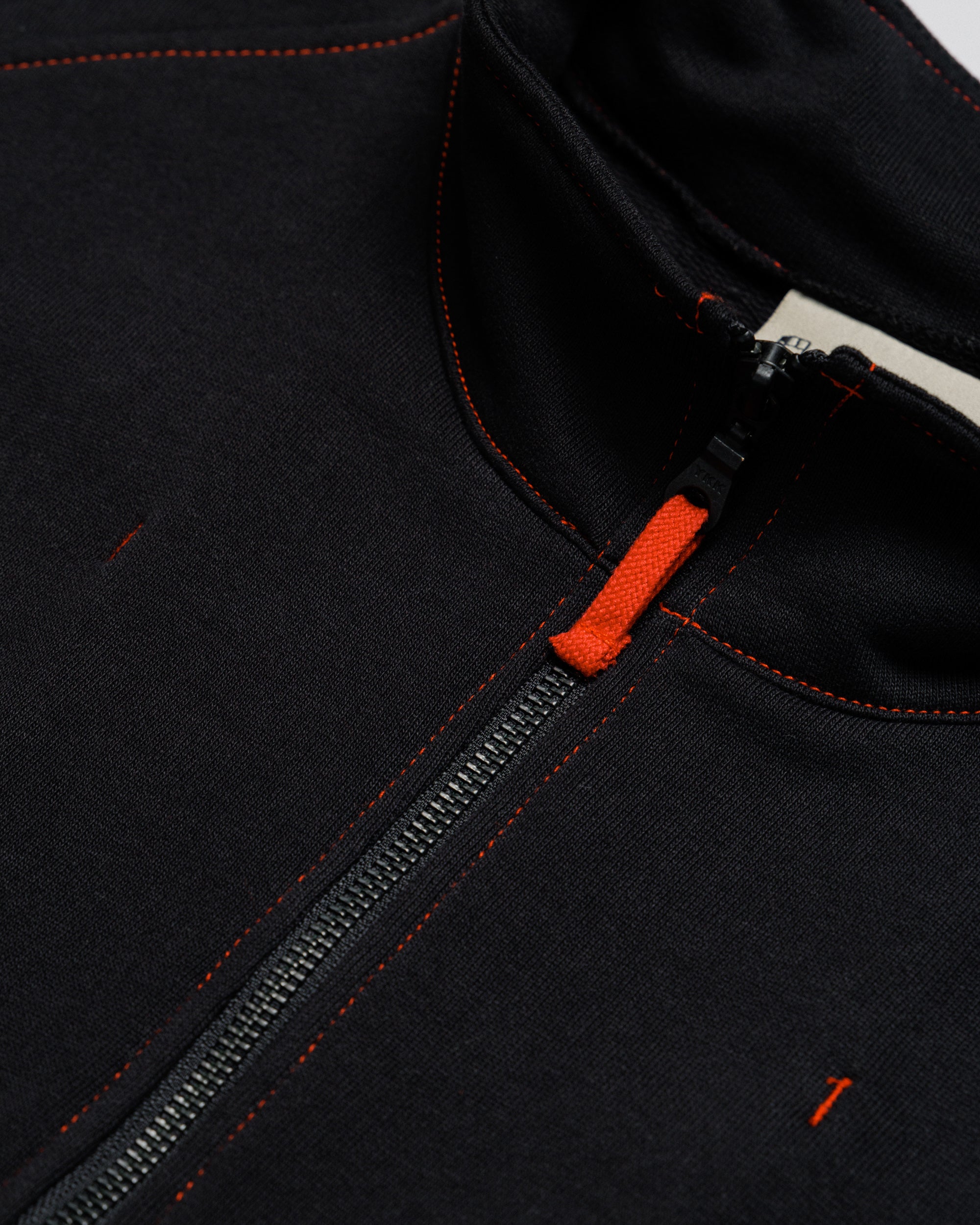 Outnback Recovery Cape in black, front zip and funnel collar detail