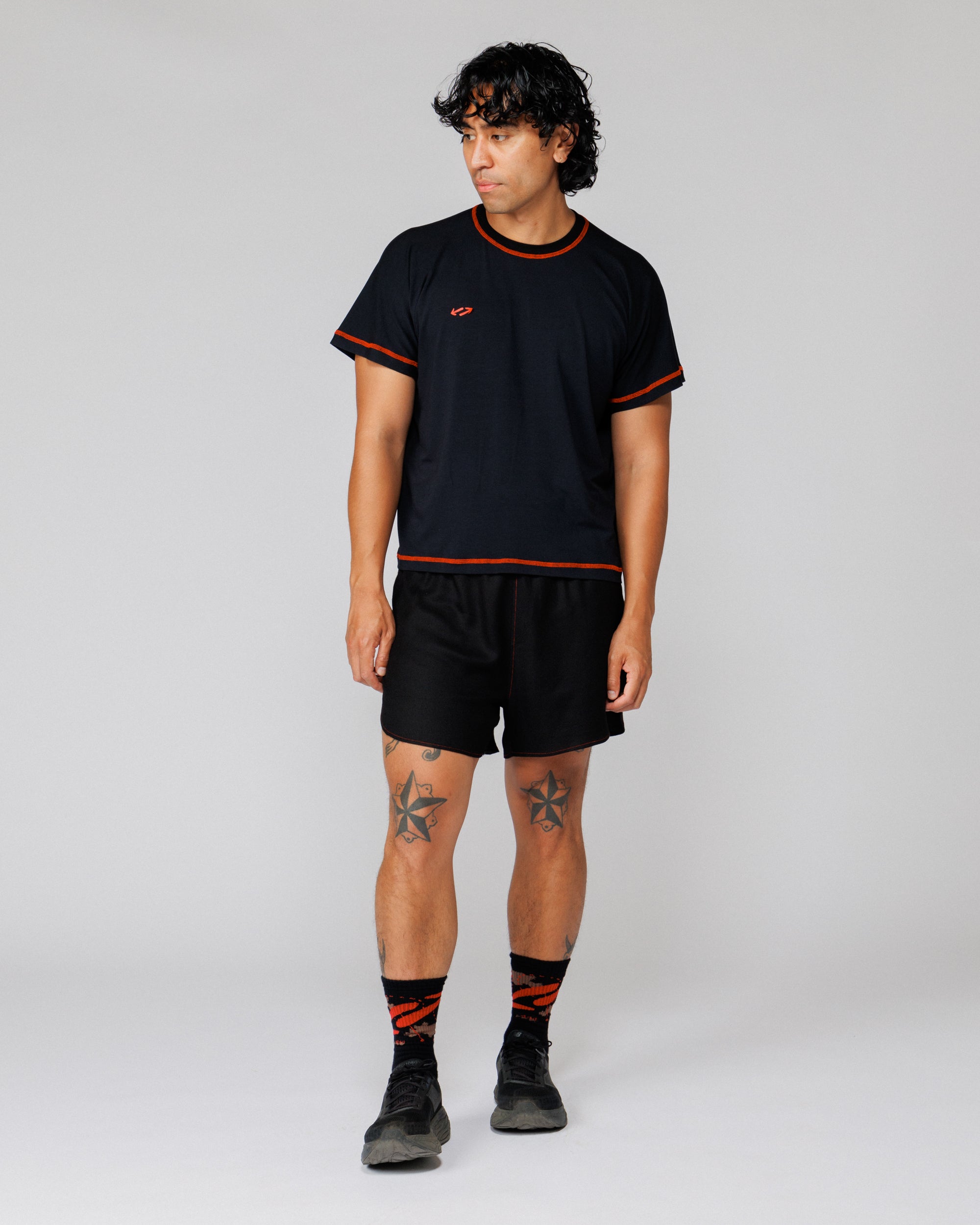 Outnback Running Short in black, relaxed front view on model