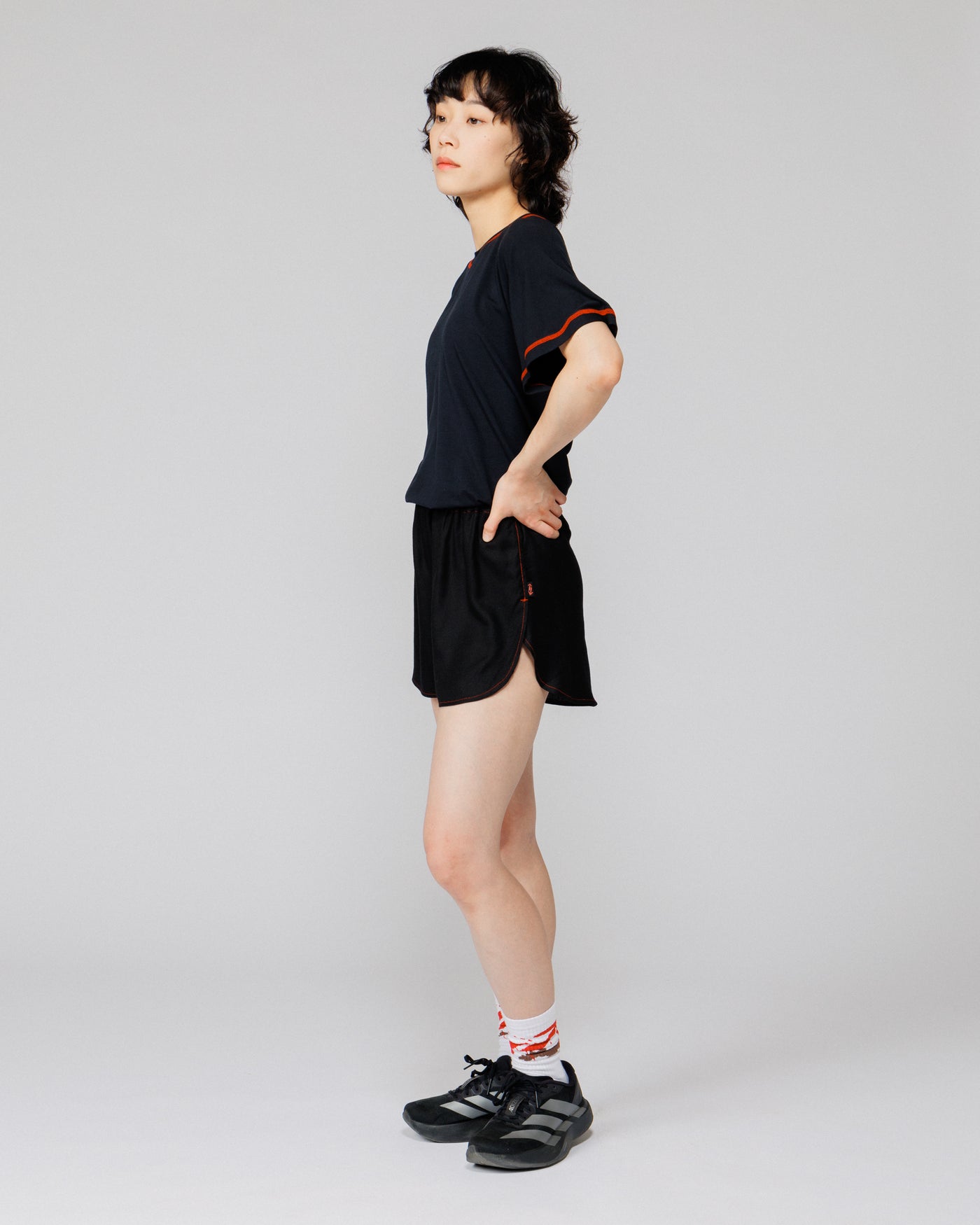 Outnback Running Short in black, side profile on model