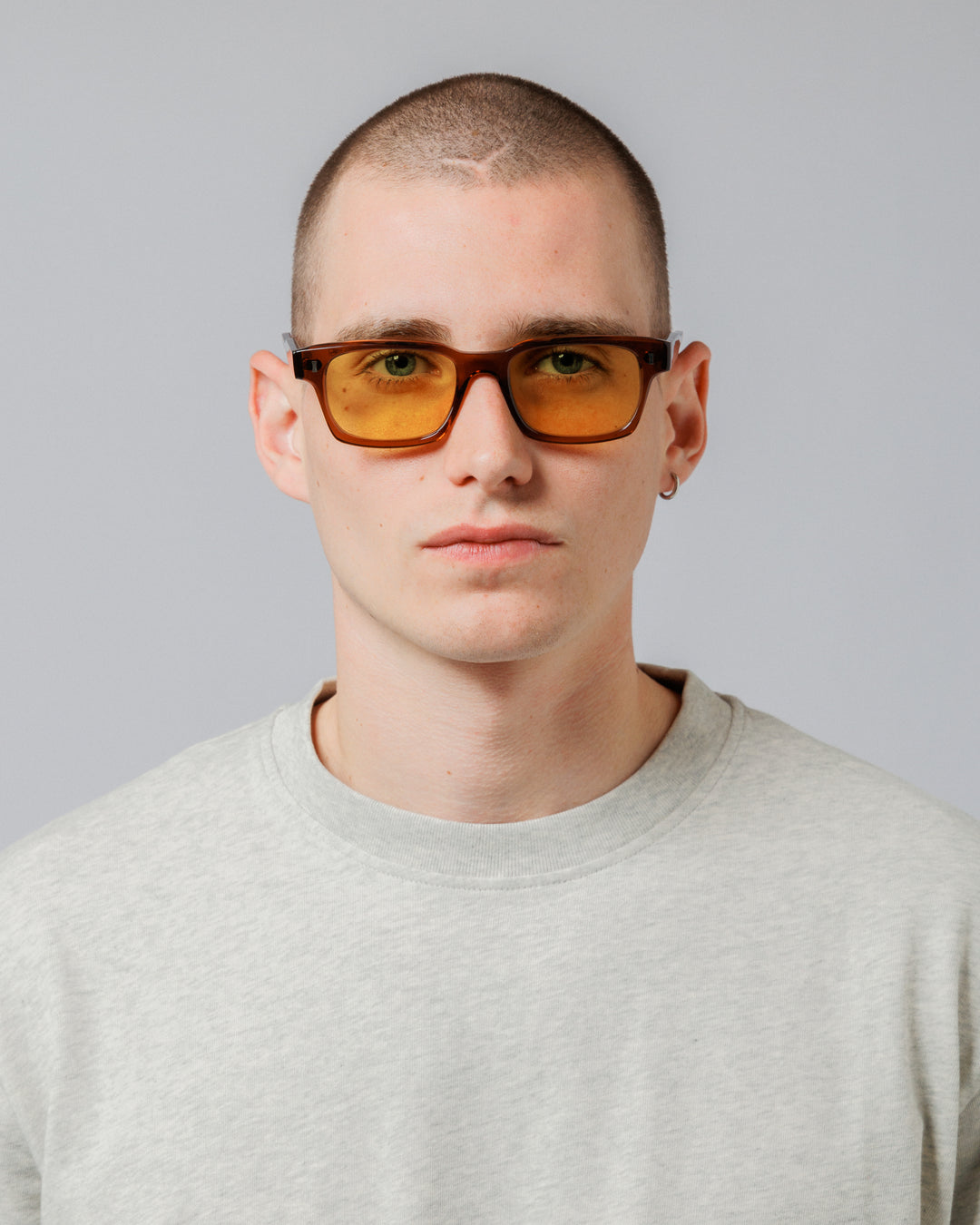 Male model wearing Solaris Sunglasses in coconut, front view