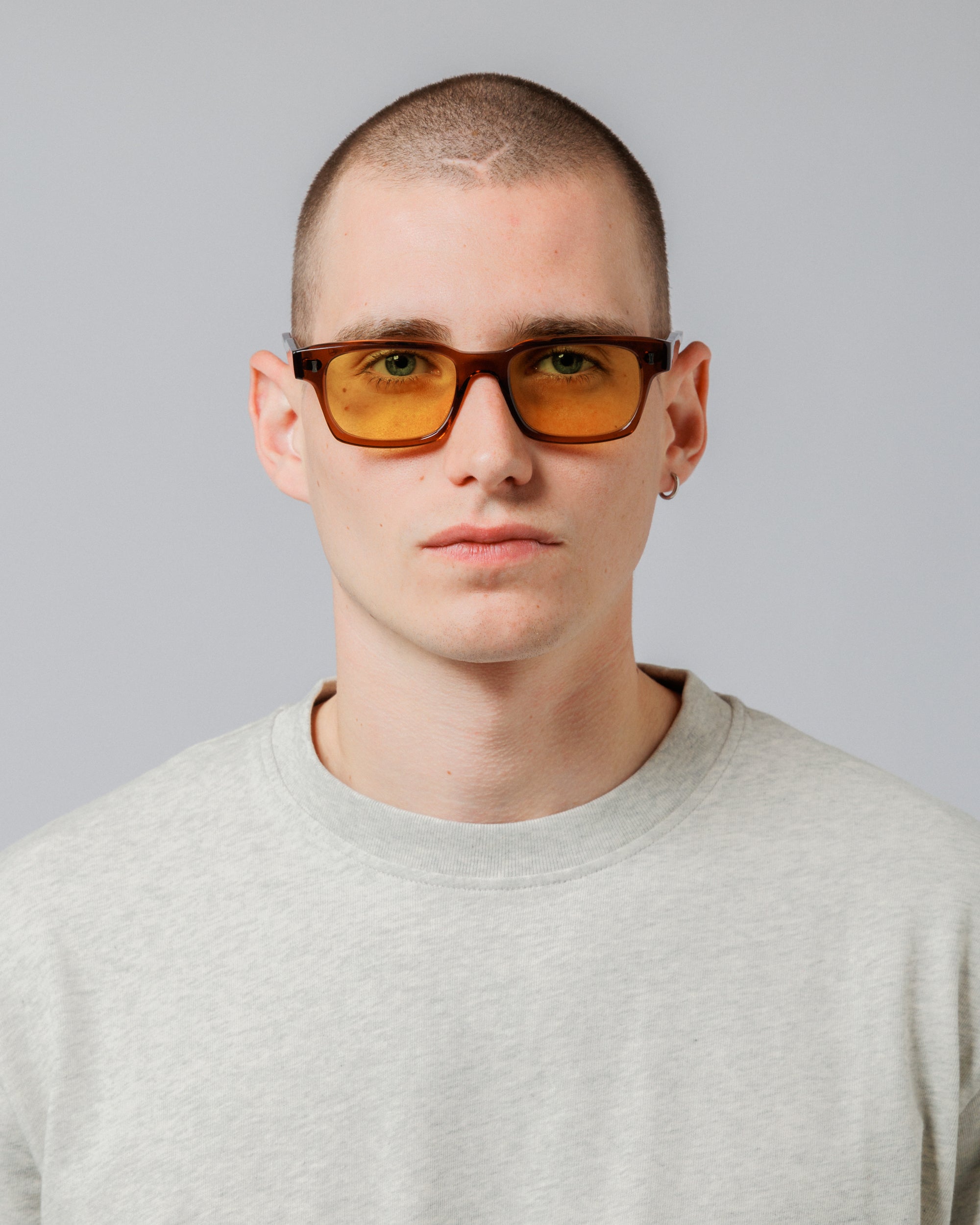 Male model wearing Solaris Sunglasses in coconut, front view