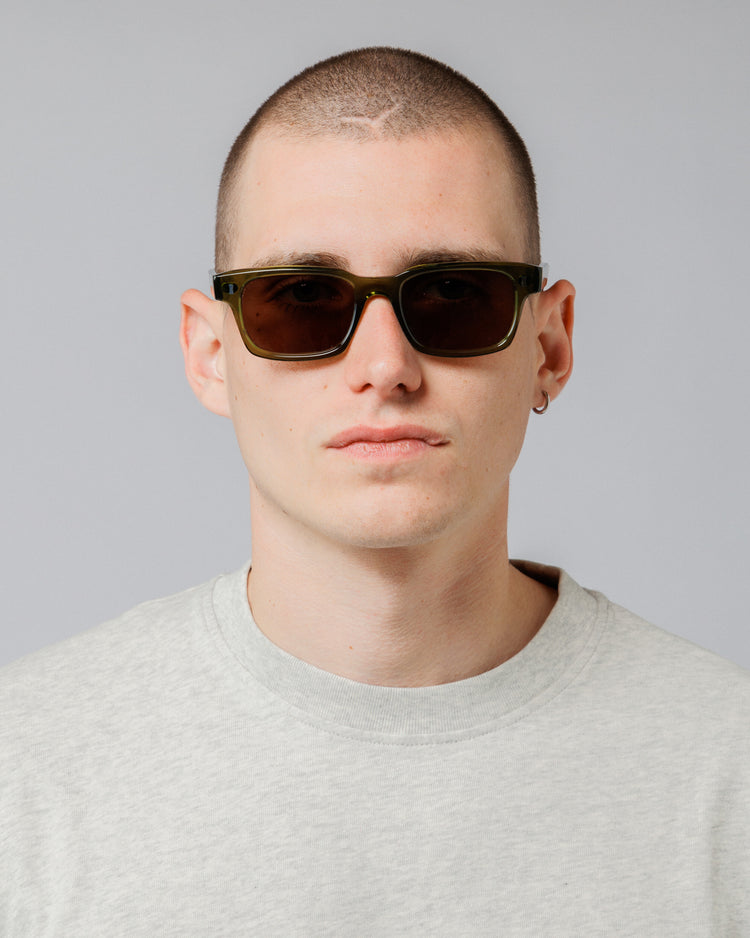 Male model wearing Solaris Sunglasses in khaki, front view