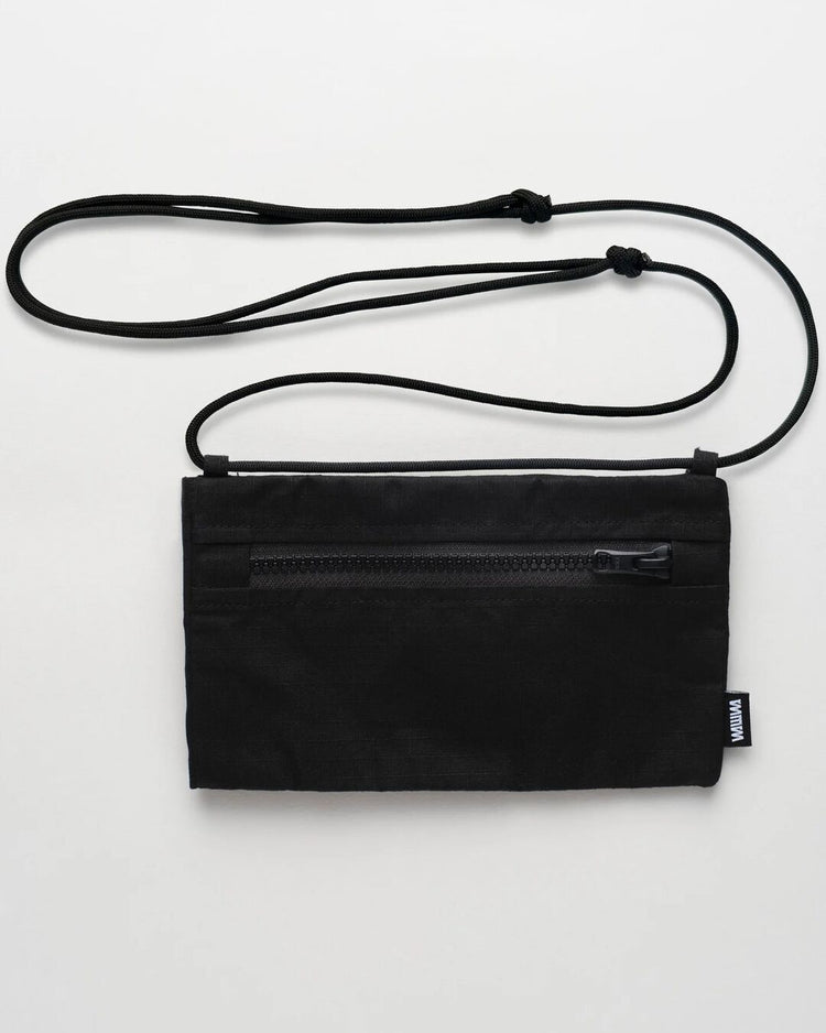 Black Sunnies Sling back view showing zip pocket