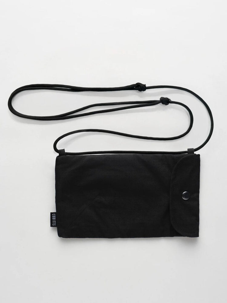 WAWWA x Cubitts Sunnies Sling in black with adjustable cord strap, front view