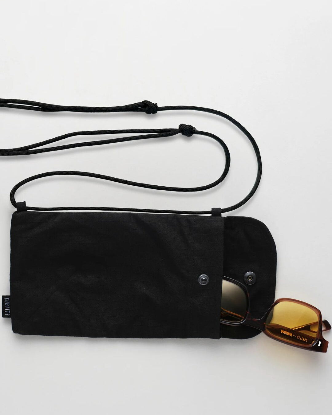 Black Sunnies Sling open with sunglasses inside