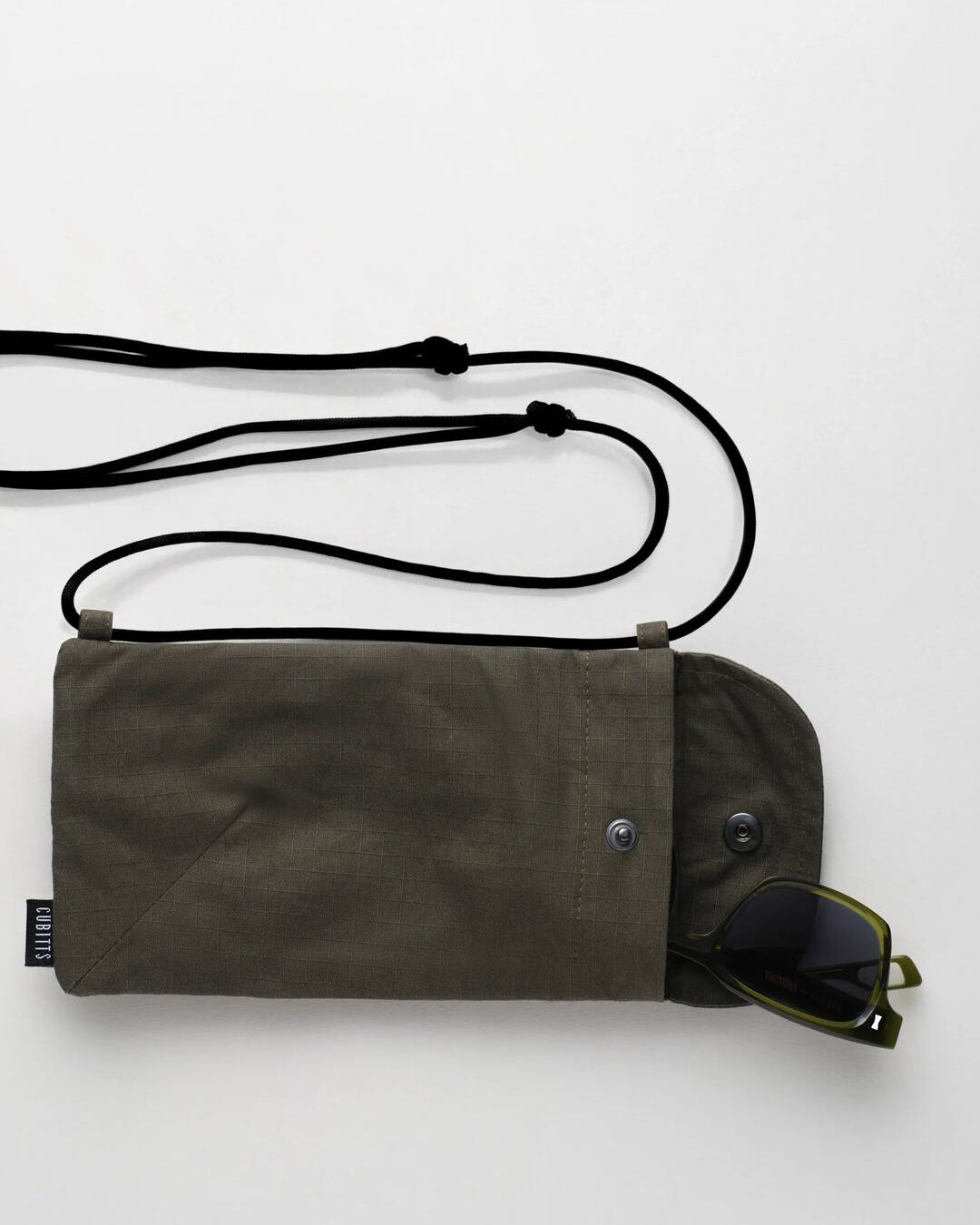 Khaki Sunnies Sling open with sunglasses inside