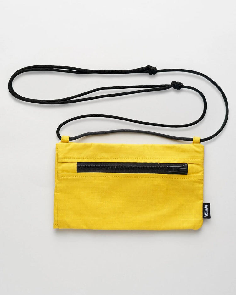 Yellow Sunnies Sling back view showing zip pocket
