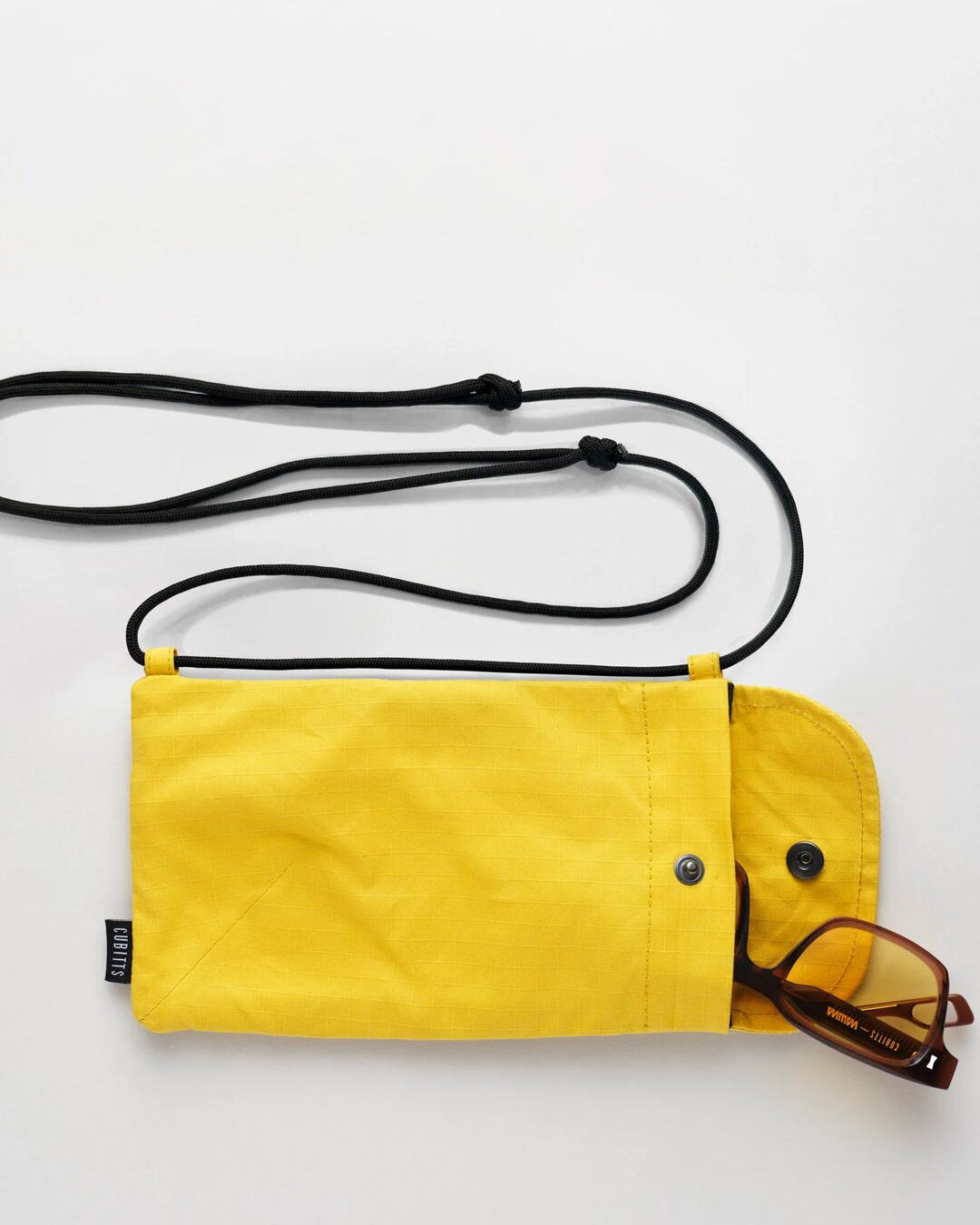 Yellow Sunnies Sling open with sunglasses inside